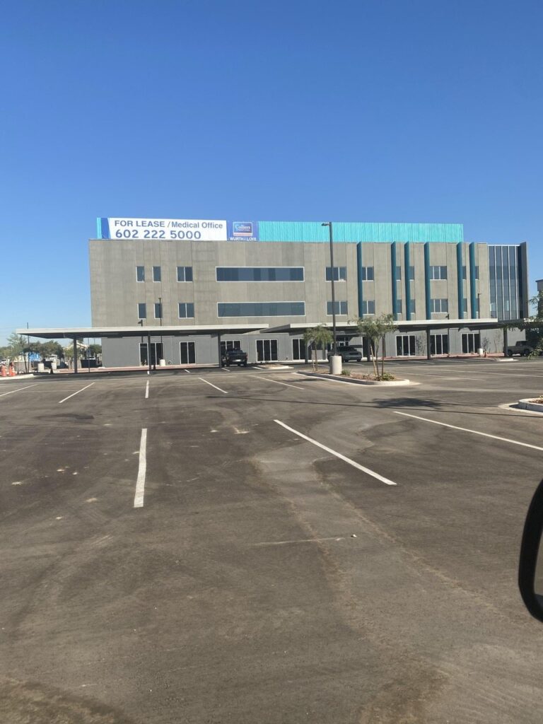 Parapet banner above a medical office building, fabricated and installed by Signs Up