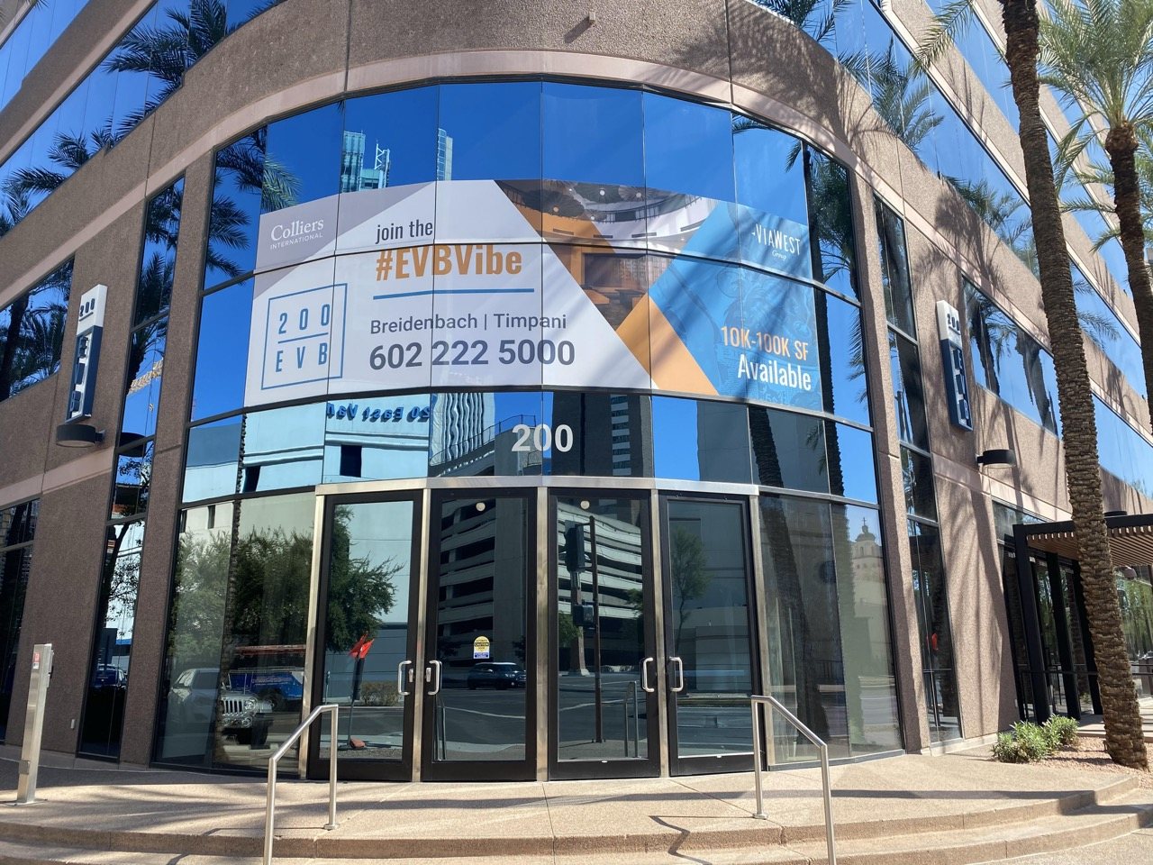 Window graphics on curved glass at 200 East Van Buren in downtown Phoenix